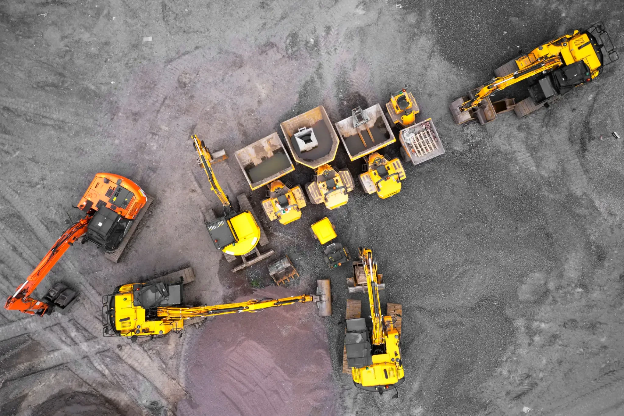 Excavator working in a utility trench on a site development project