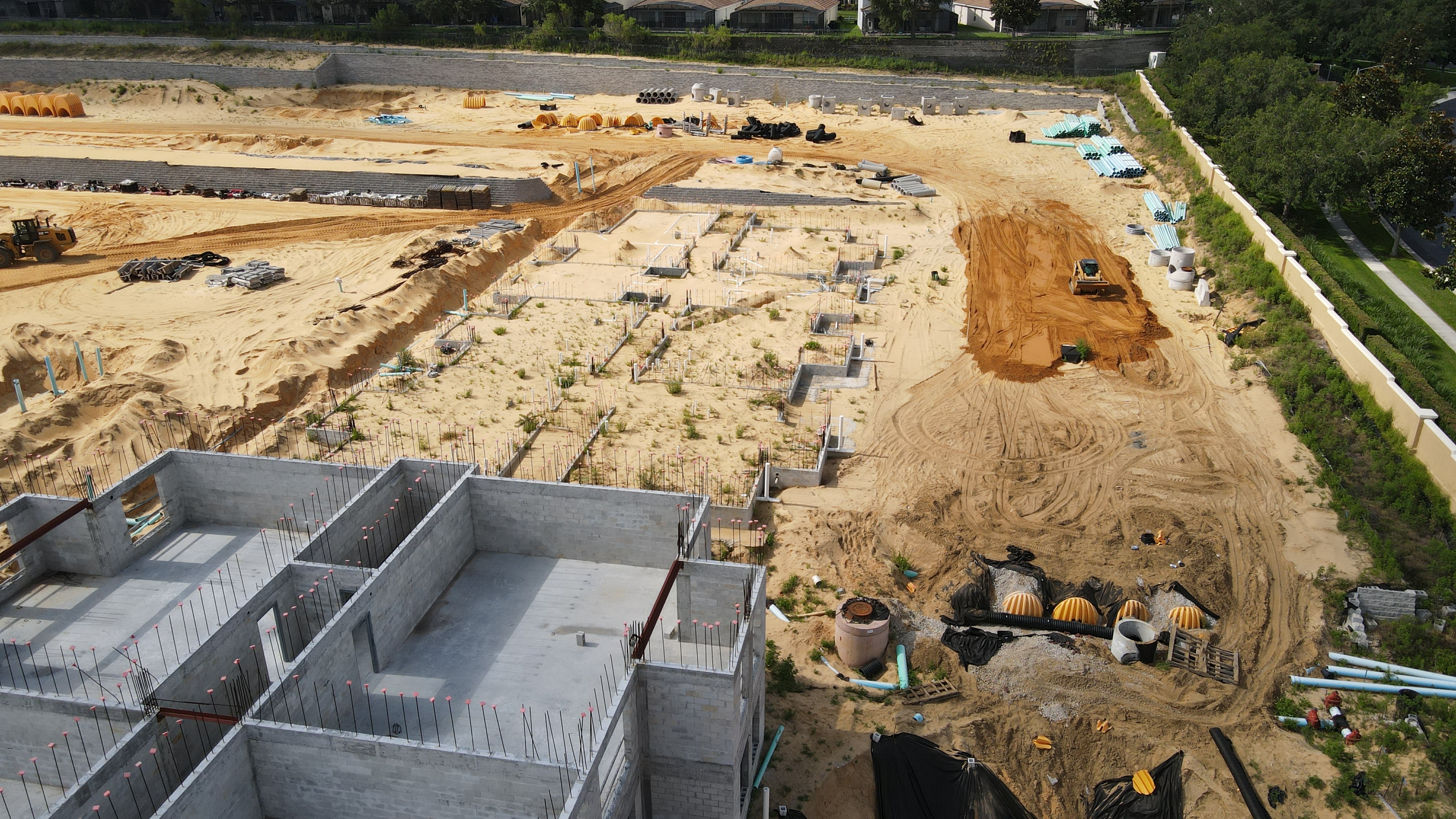 Camcor aerial construction site with foundations and drainage